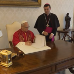 Pope Leo XIV signing the Magnifica humanitas